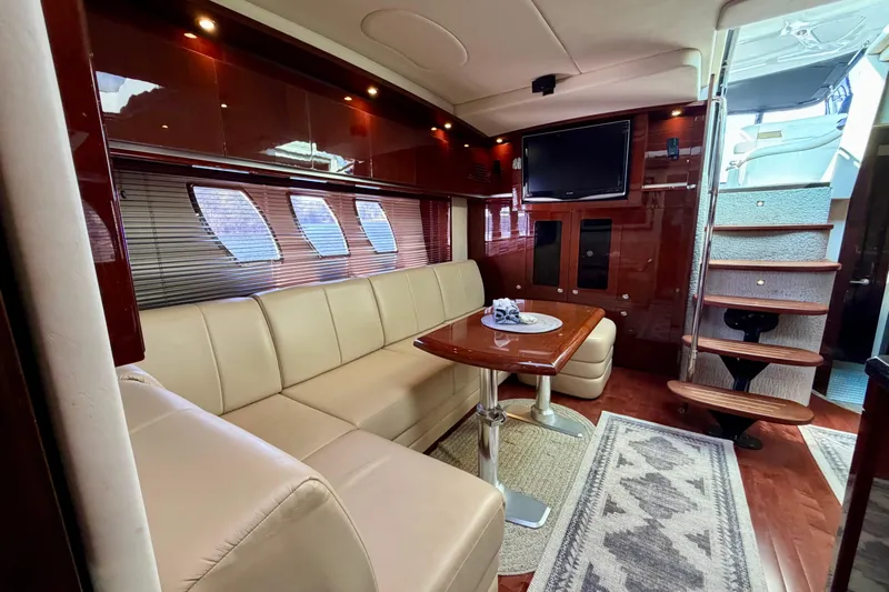  Yacht Photos Pics Luxurious interior of 2009 Sea Ray 48 Sundancer yacht with plush seating and elegant decor.