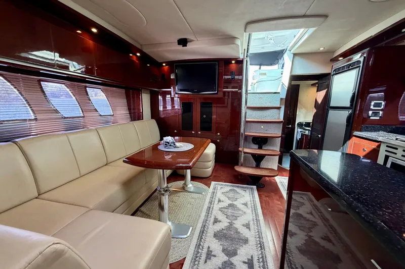  Yacht Photos Pics Luxurious interior of 2009 Sea Ray 48 Sundancer yacht with leather seating and modern amenities.