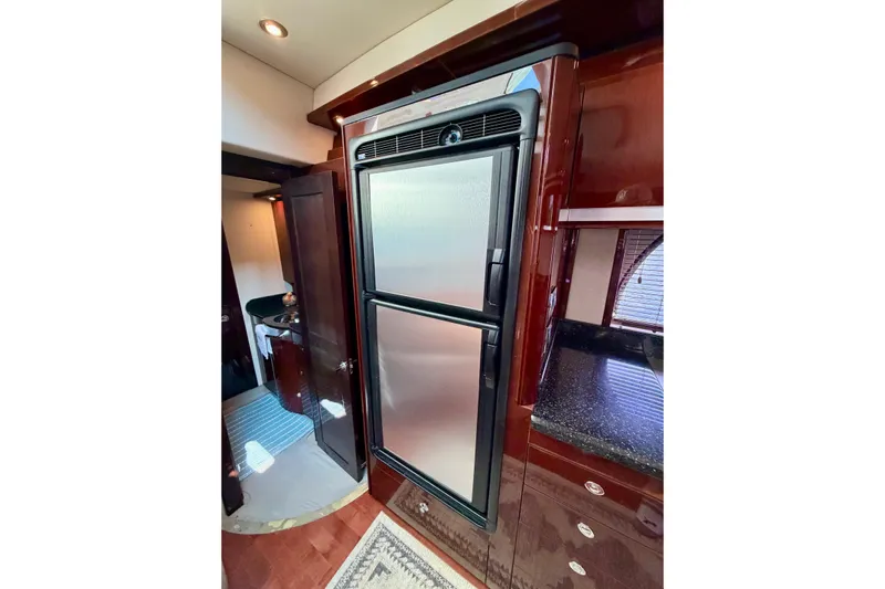  Yacht Photos Pics Luxurious 2009 Sea Ray 48 Sundancer yacht interior with stainless steel refrigerator.