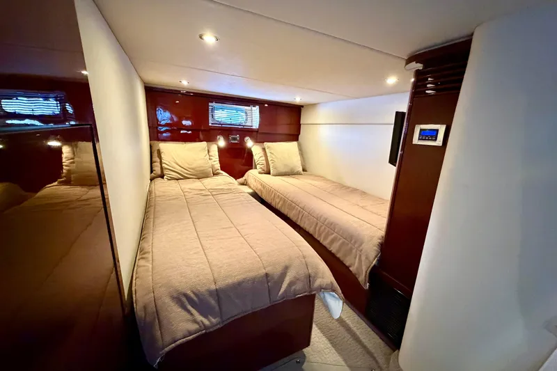  Yacht Photos Pics Interior of 2009 Sea Ray 48 Sundancer with twin beds and modern lighting.