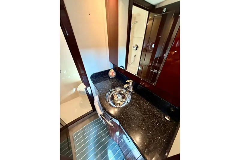  Yacht Photos Pics Luxurious bathroom in 2009 Sea Ray 48 Sundancer yacht with sleek fixtures and modern design.