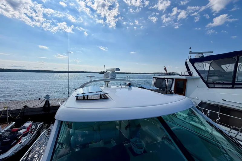  Yacht Photos Pics 2009 Sea Ray 48 Sundancer yacht docked under a clear blue sky.