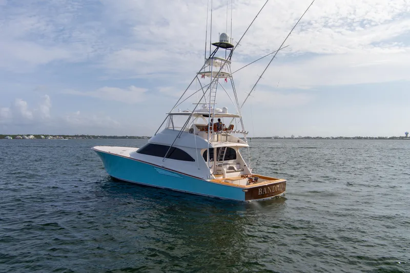 Bandito Yacht Photos Pics 2015 Viking 70 Convertible yacht on open water under a clear sky.