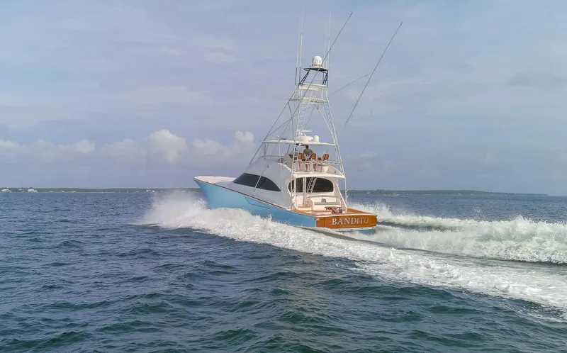 Bandito Yacht Photos Pics 2015 Viking 70 Convertible yacht cruising on open water.