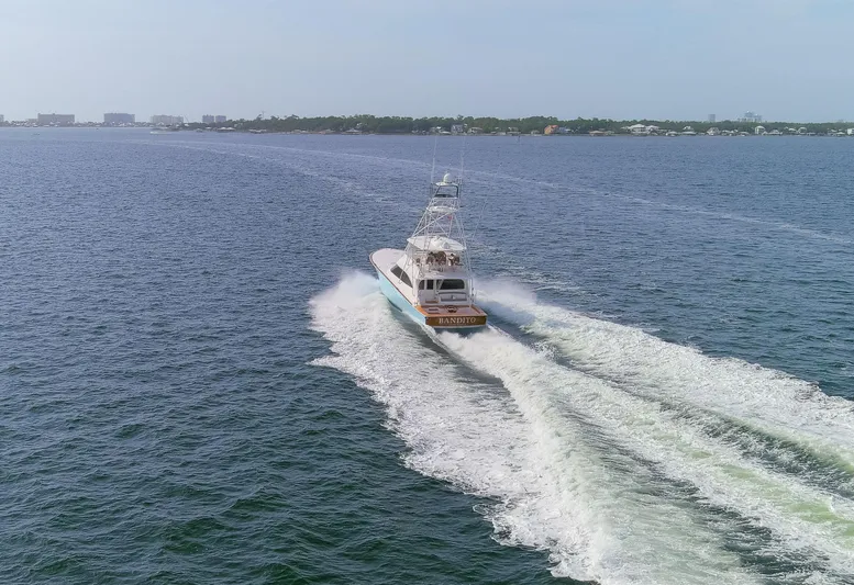 Bandito Yacht Photos Pics Viking 70 Convertible yacht cruising on open water, 2015 model.