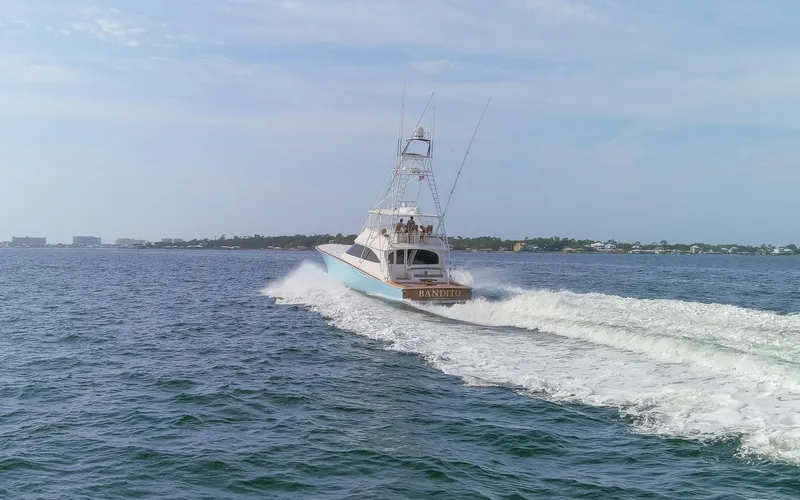 Bandito Yacht Photos Pics 2015 Viking 70 Convertible yacht cruising on open water.