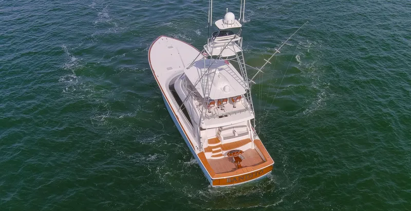 Bandito Yacht Photos Pics Aerial view of 2015 Viking 70 Convertible yacht cruising on open water.