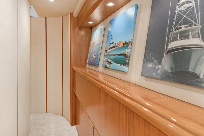 Bandito Yacht Photos Pics Interior hallway of 2015 Viking 70 Convertible yacht with nautical artwork.
