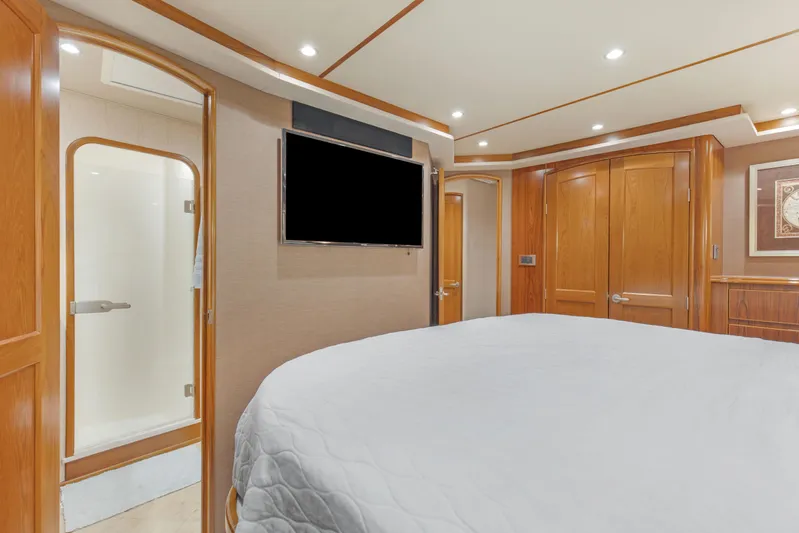 Bandito Yacht Photos Pics Luxurious interior of 2015 Viking 70 Convertible yacht with wood paneling and modern amenities.