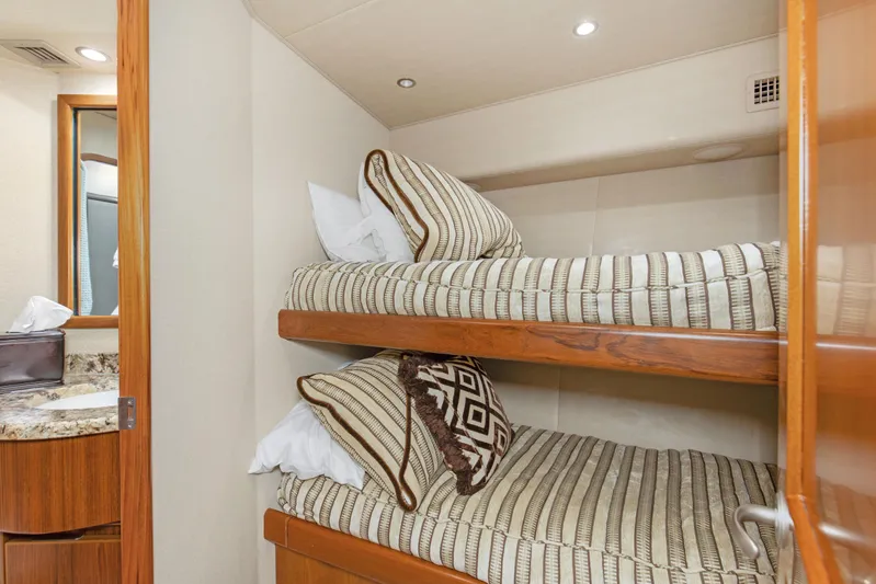 Bandito Yacht Photos Pics Bunk beds in 2015 Viking 70 Convertible yacht cabin with striped bedding.