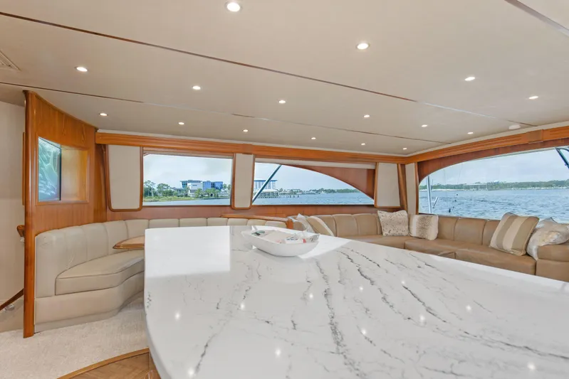 Bandito Yacht Photos Pics Luxurious interior of 2015 Viking 70 Convertible yacht with elegant seating and marble countertop.
