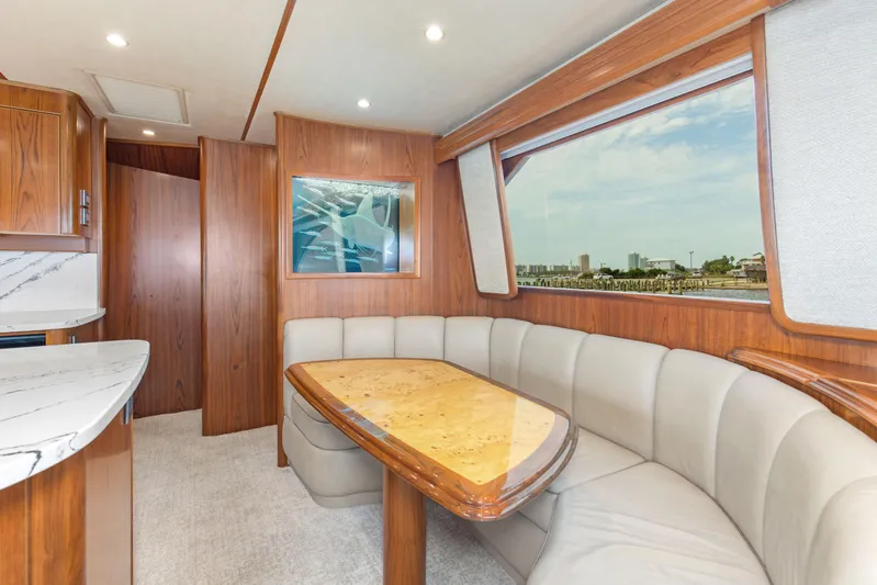 Bandito Yacht Photos Pics Luxurious interior of 2015 Viking 70 Convertible yacht with elegant dining area.