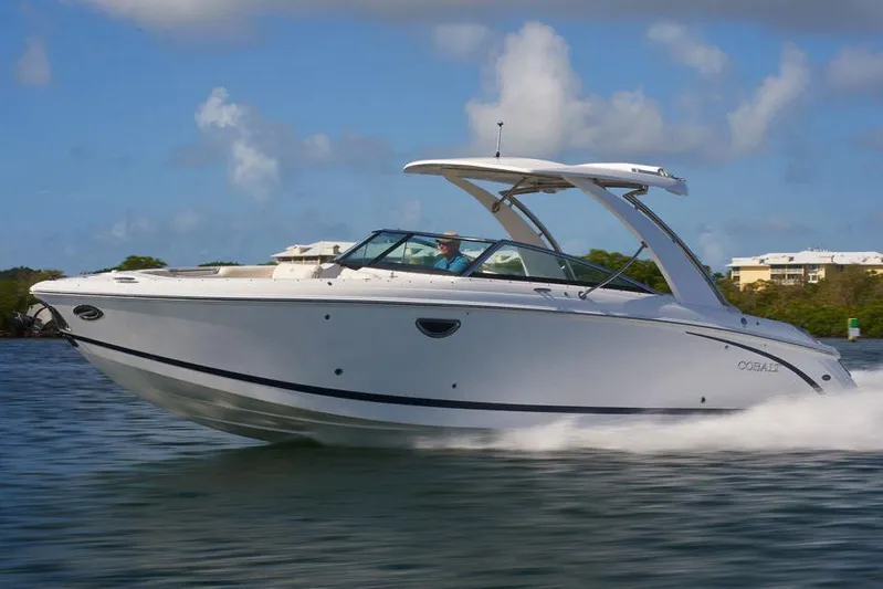  Yacht Photos Pics Manufacturer Provided Image: 2020 Cobalt R30 boat cruising on water under a clear blue sky.