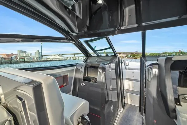  Yacht Photos Pics Interior view of 2018 Cobalt A36 boat with modern seating and open water backdrop.