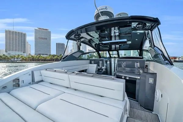  Yacht Photos Pics 2018 Cobalt A36 yacht with luxurious seating, city skyline in background.