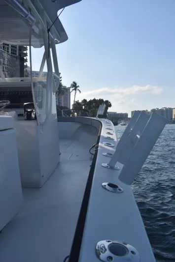 Pamela Ann Yacht Photos Pics 2017 Conch 30 boat on water, featuring sleek design and rod holders.