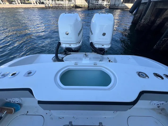 Pamela Ann Yacht Photos Pics 2017 Conch 30 boat with dual engines, docked by the water.