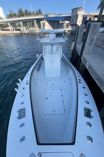 Pamela Ann Yacht Photos Pics 2017 Conch 30 boat docked by a waterfront pier.