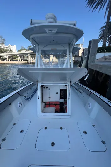 Pamela Ann Yacht Photos Pics 2017 Conch 30 boat with open deck and console, docked by the waterfront.
