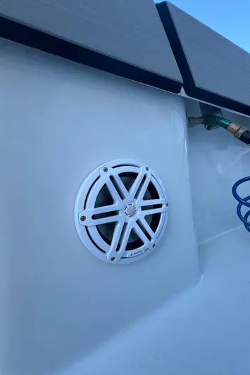 Pamela Ann Yacht Photos Pics 2017 Conch 30 boat speaker with white grille and blue hose in background.