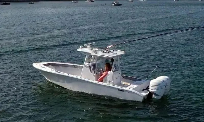 Pamela Ann Yacht Photos Pics 2018 Conch 30 boat on water, featuring dual outboard motors and center console.