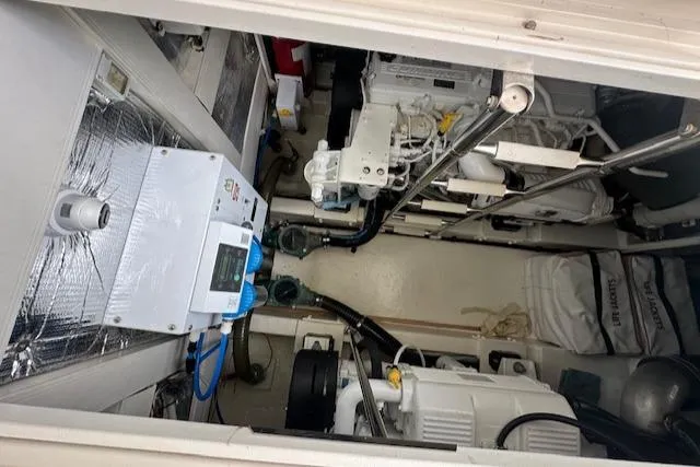  Yacht Photos Pics Engine room of 2013 Uniesse 49 EXPRESS yacht, showcasing mechanical components and equipment.