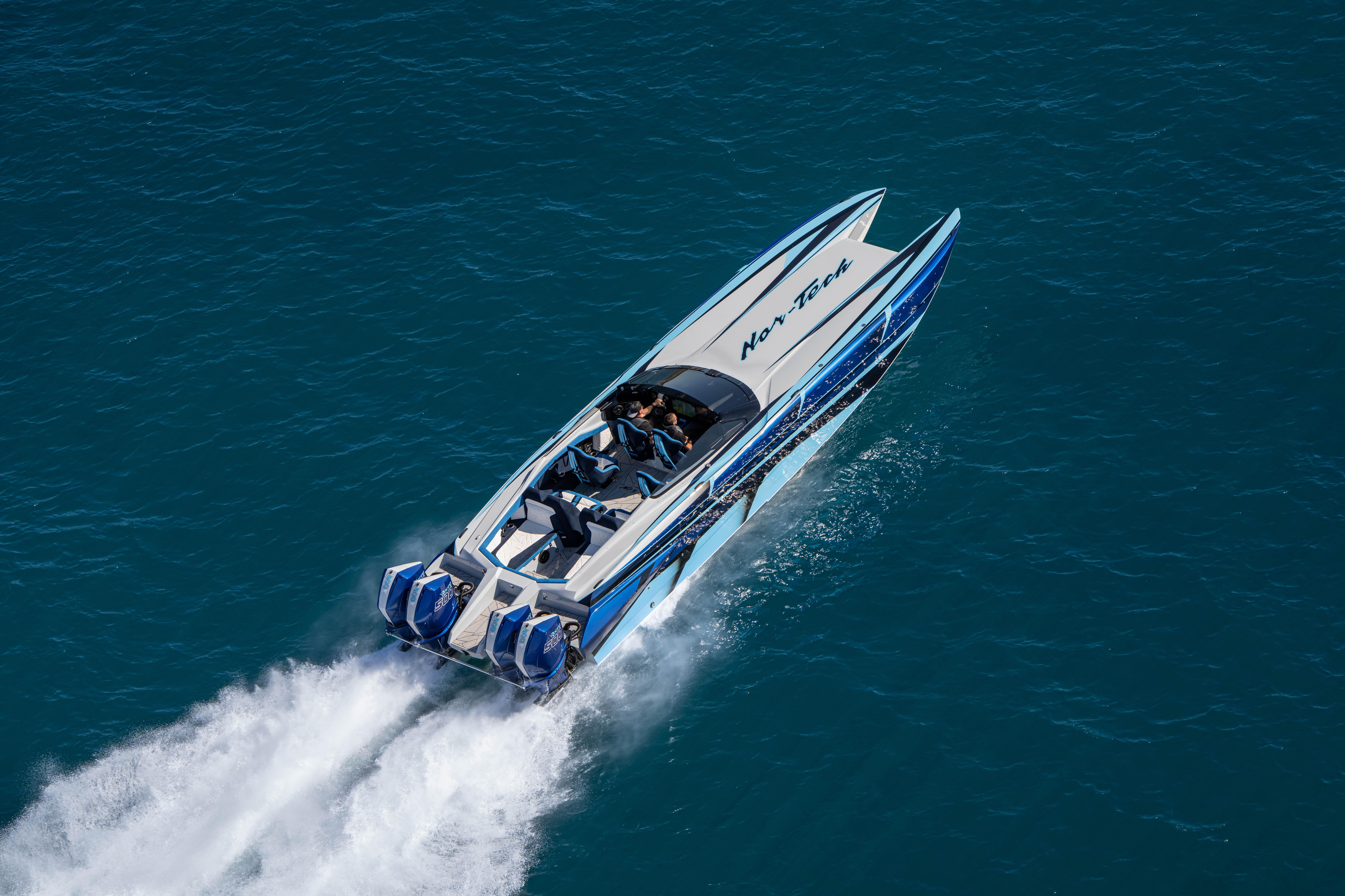 2026 Nor-Tech 4000 Super Catamaran speeding on open water, showcasing sleek design.