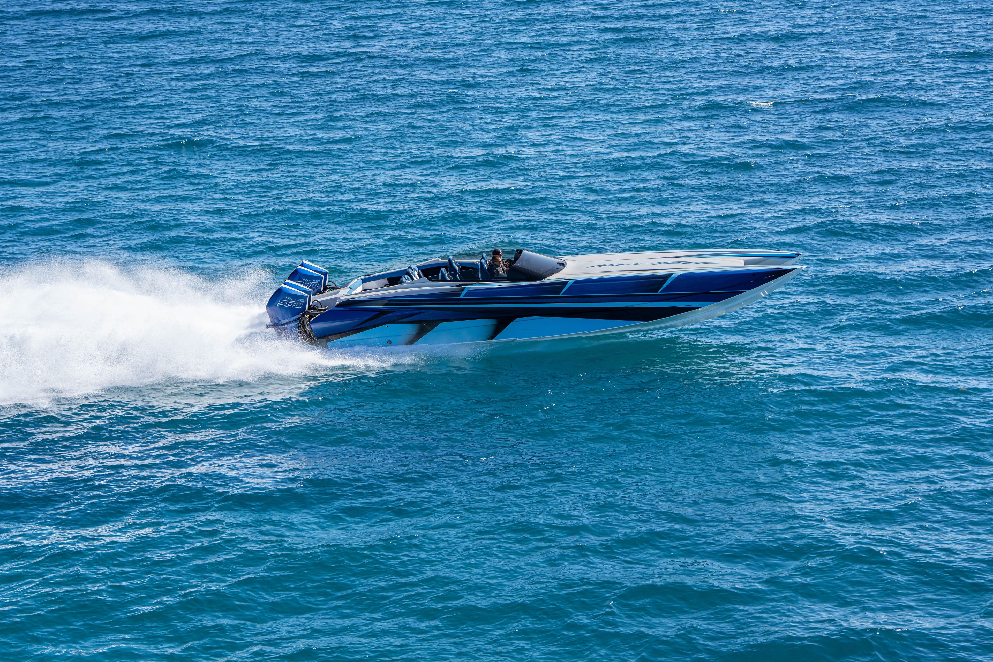 2026 Nor-Tech 4000 Super Catamaran speeding on open water, showcasing sleek design and power.