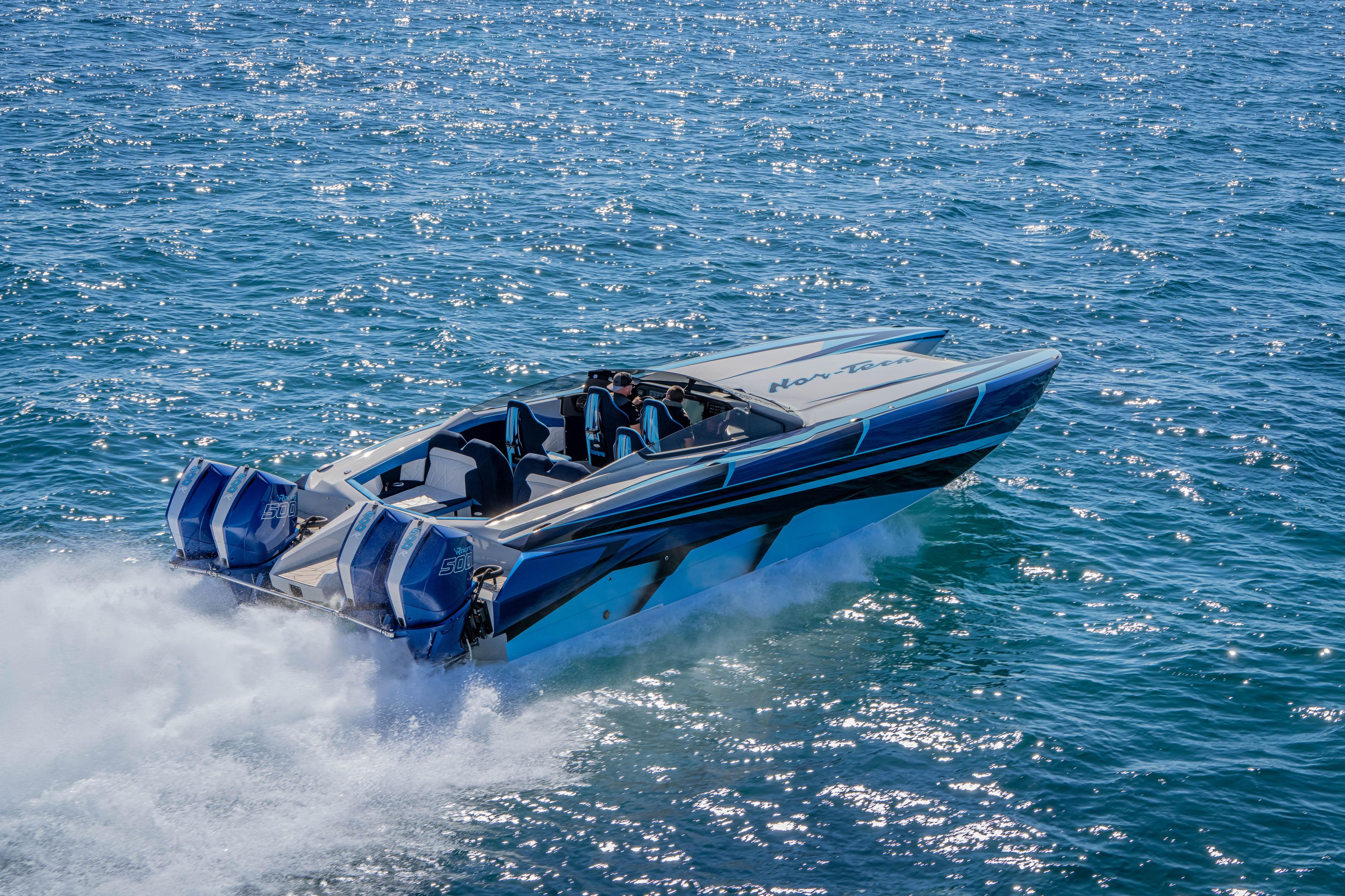 2026 Nor-Tech 4000 Super Catamaran speeding on open water, showcasing sleek design and power.