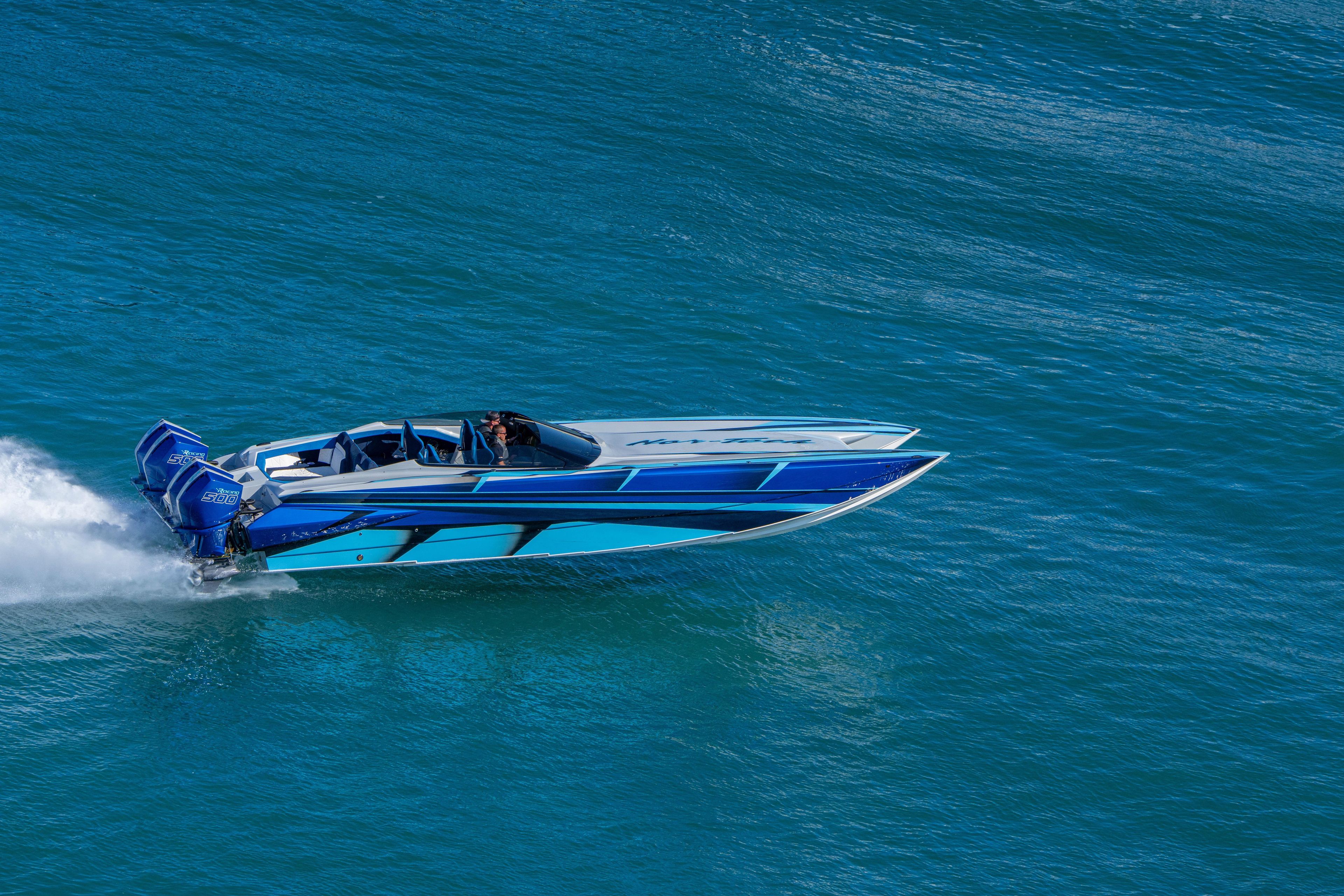 2026 Nor-Tech 4000 Super Catamaran speeding on blue ocean waters.