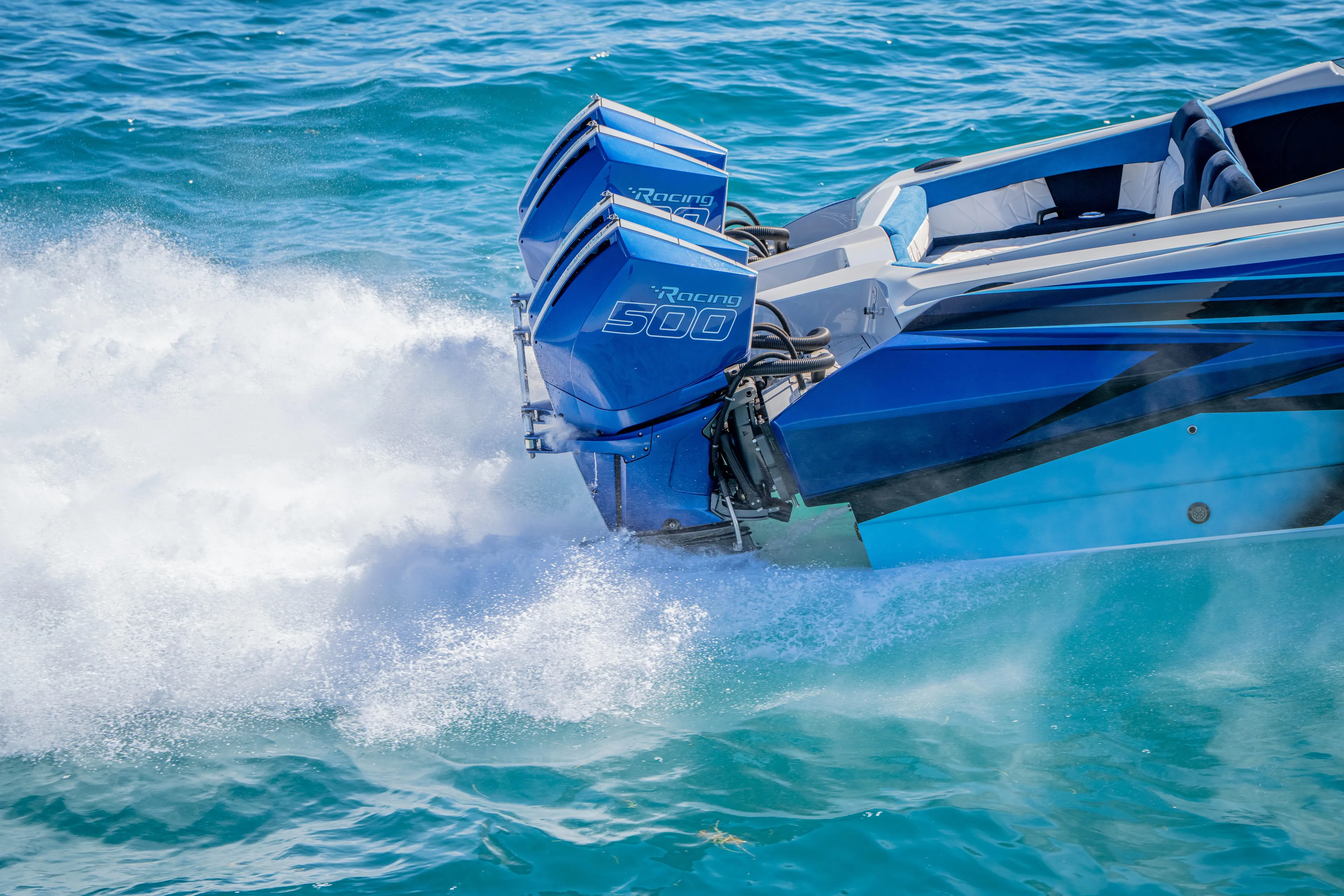  Yacht Photos Pics 2026 Nor-Tech 4000 Super Catamaran with dual Racing 500 engines on turquoise water.