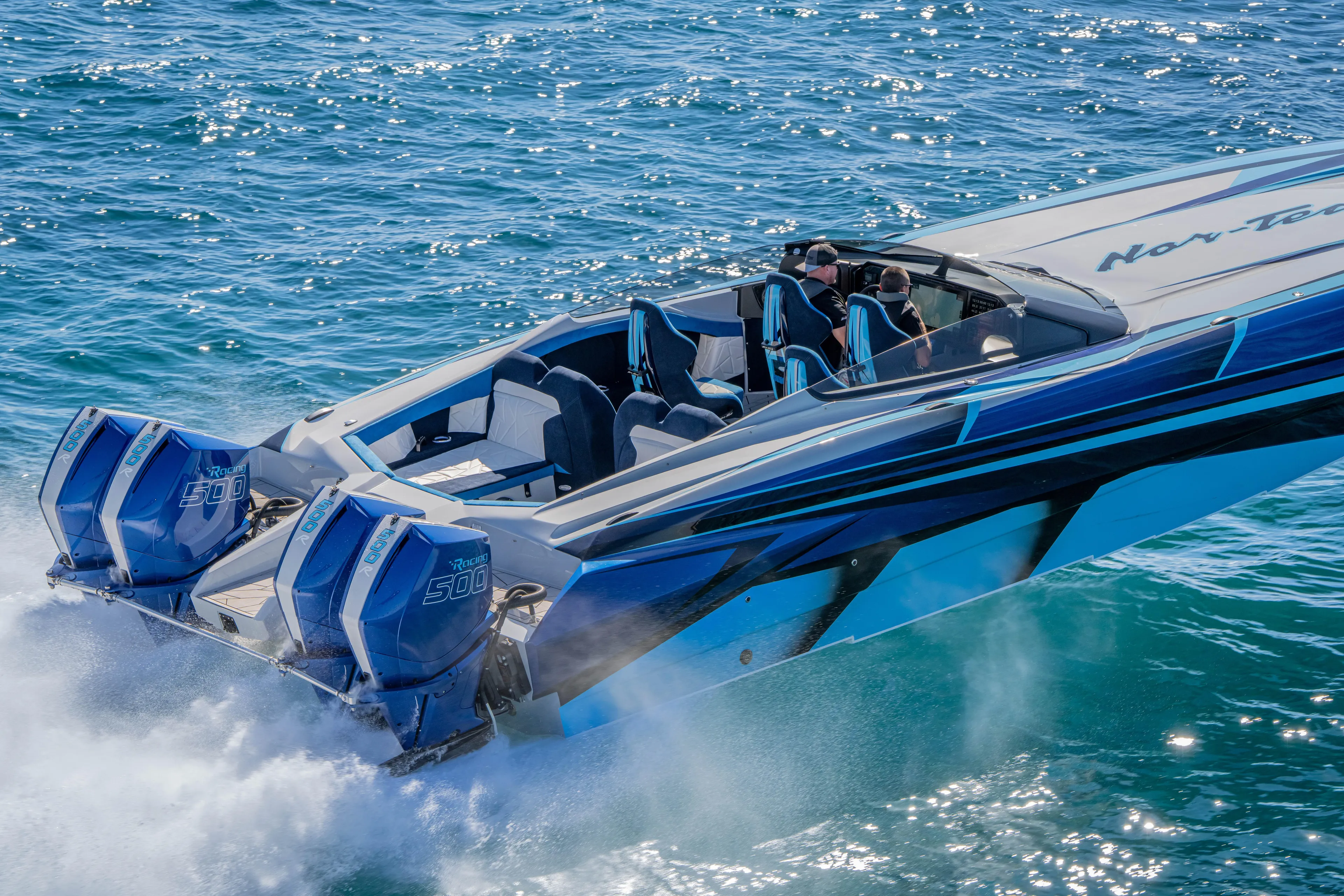  Yacht Photos Pics 2026 Nor-Tech 4000 Super Catamaran speeding on blue ocean waters.