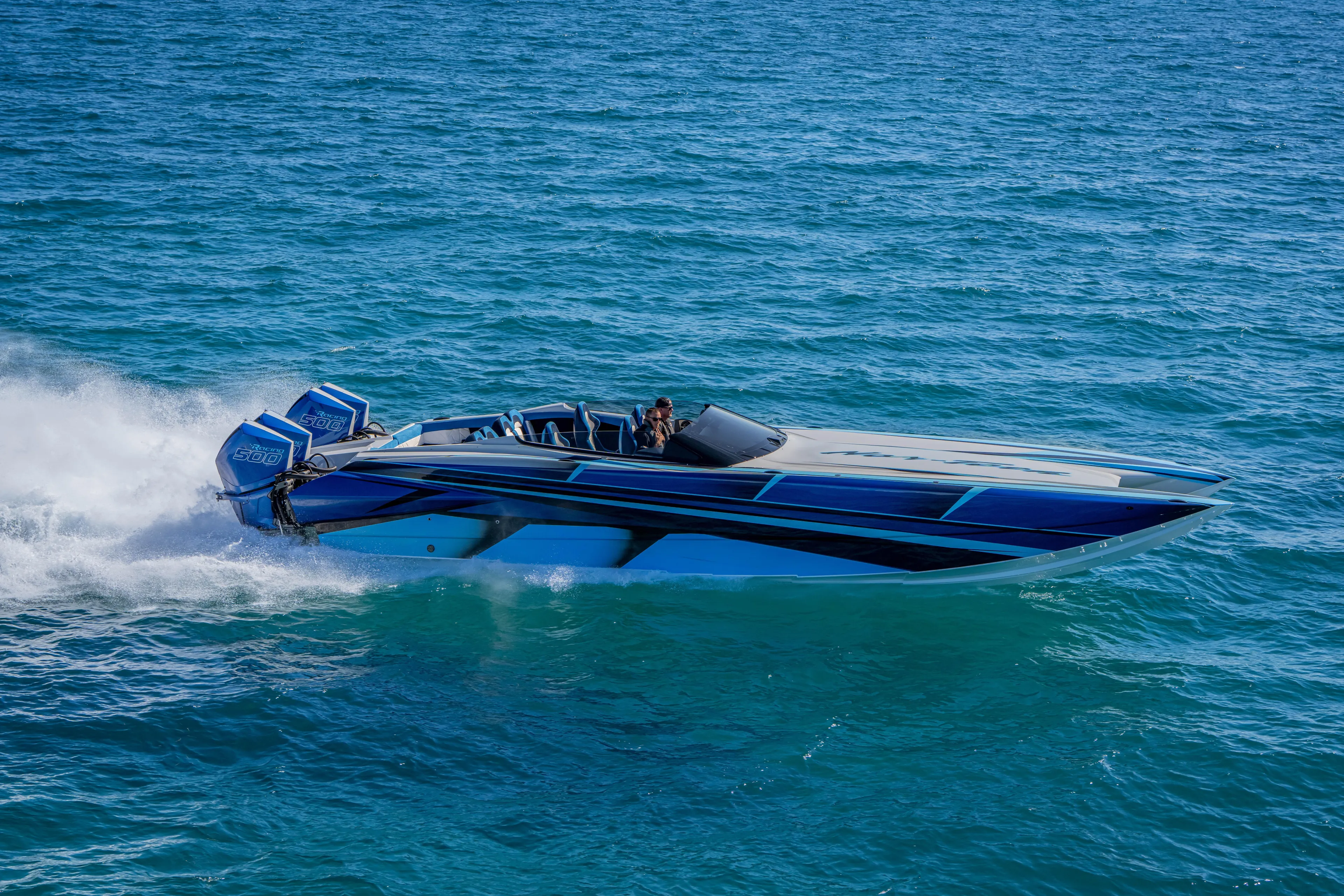  Yacht Photos Pics 2026 Nor-Tech 4000 Super Catamaran speeding on open water, showcasing sleek design.