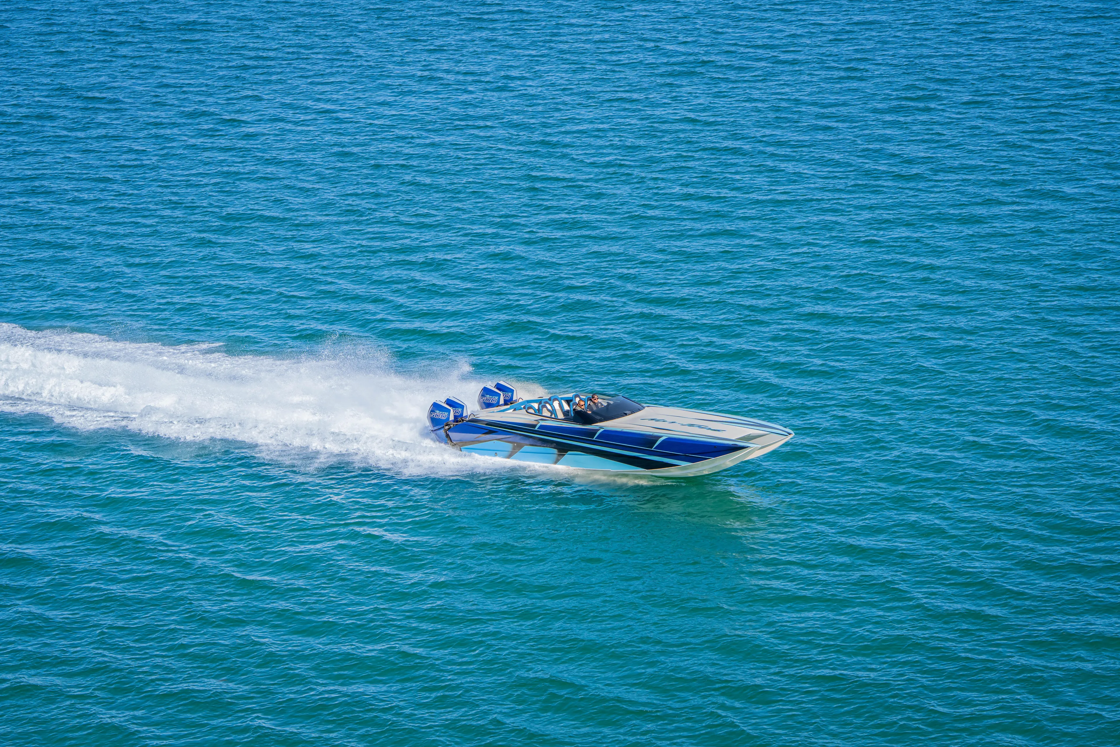  Yacht Photos Pics 2026 Nor-Tech 4000 Super Catamaran speeding on open water.