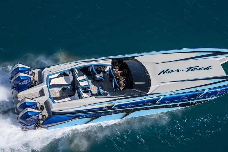  Yacht Photos Pics 2026 Nor-Tech 4000 Super Catamaran cruising on blue water, aerial view.