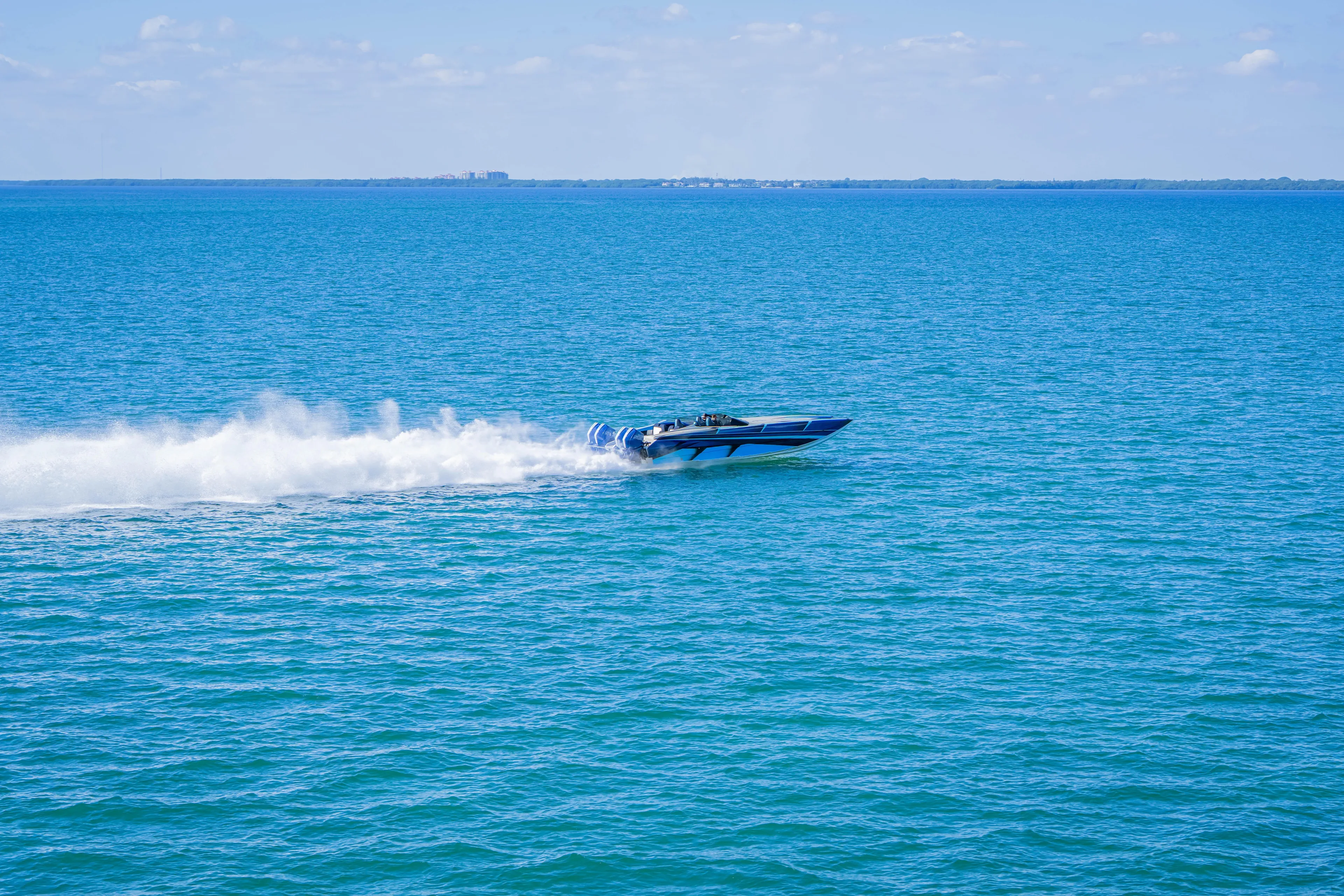  Yacht Photos Pics 2026 Nor-Tech 4000 Super Catamaran speeding across blue ocean waters.