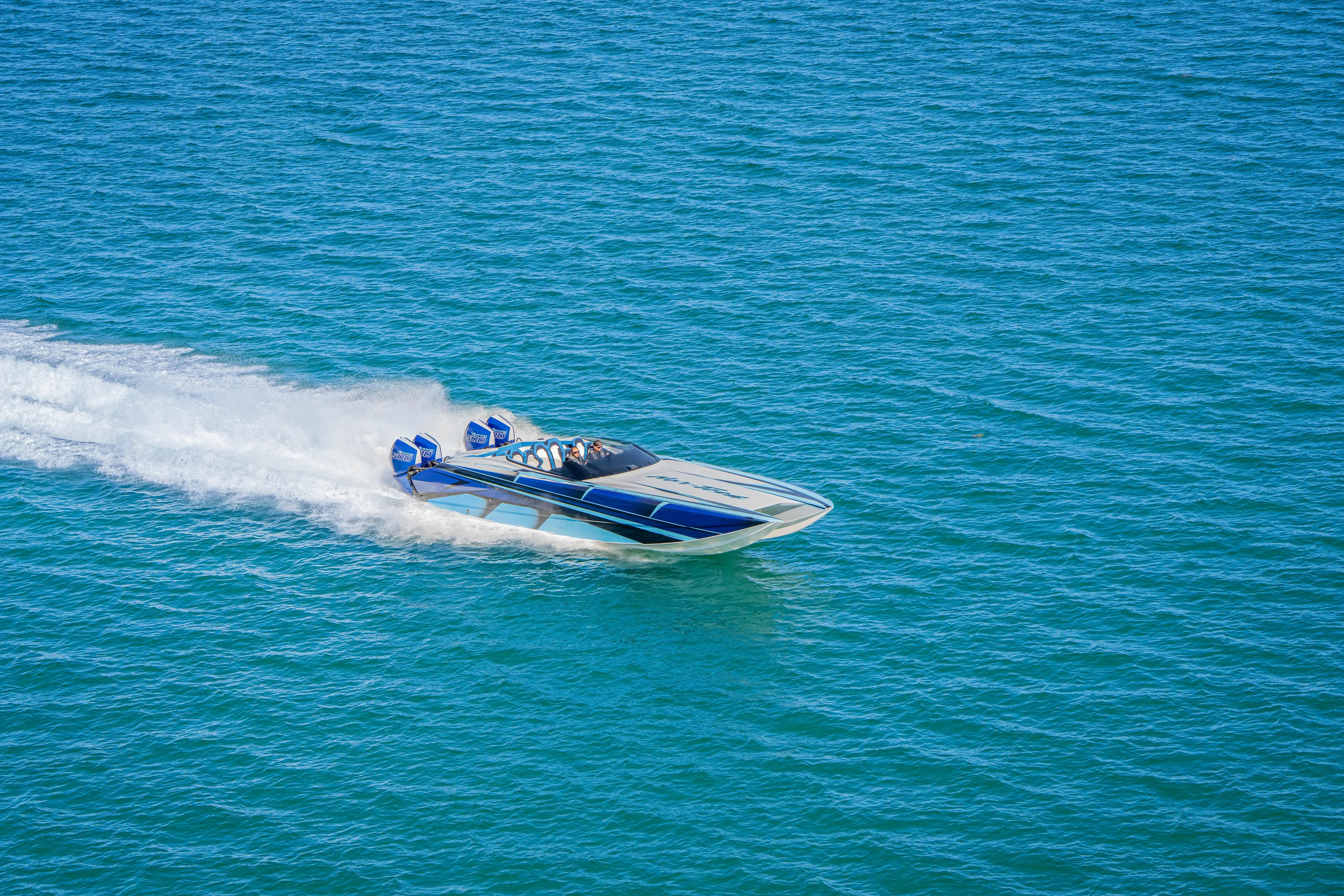  Yacht Photos Pics 2026 Nor-Tech 4000 Super Catamaran speeding on open water.