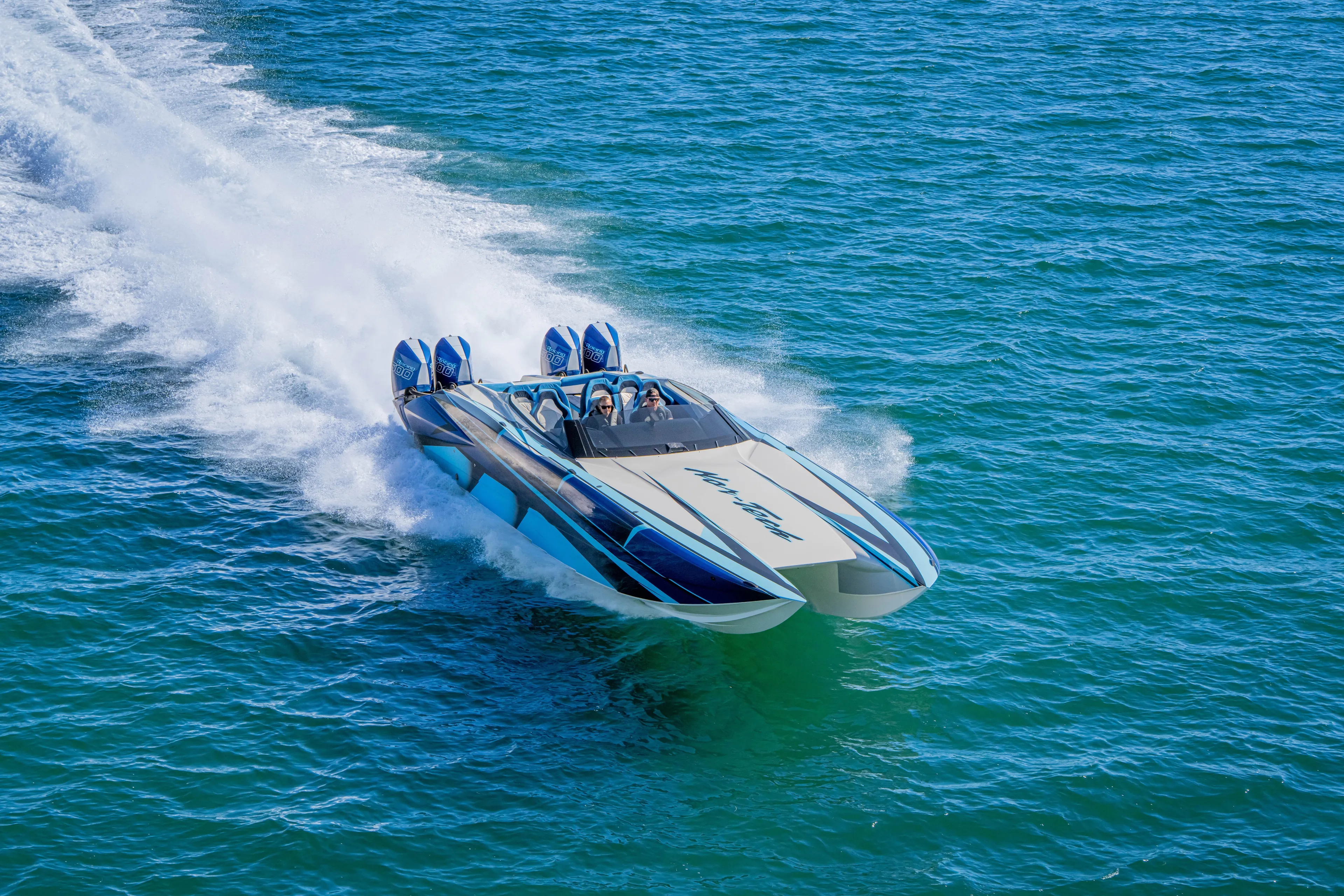  Yacht Photos Pics 2026 Nor-Tech 4000 Super Catamaran speeding on open water.