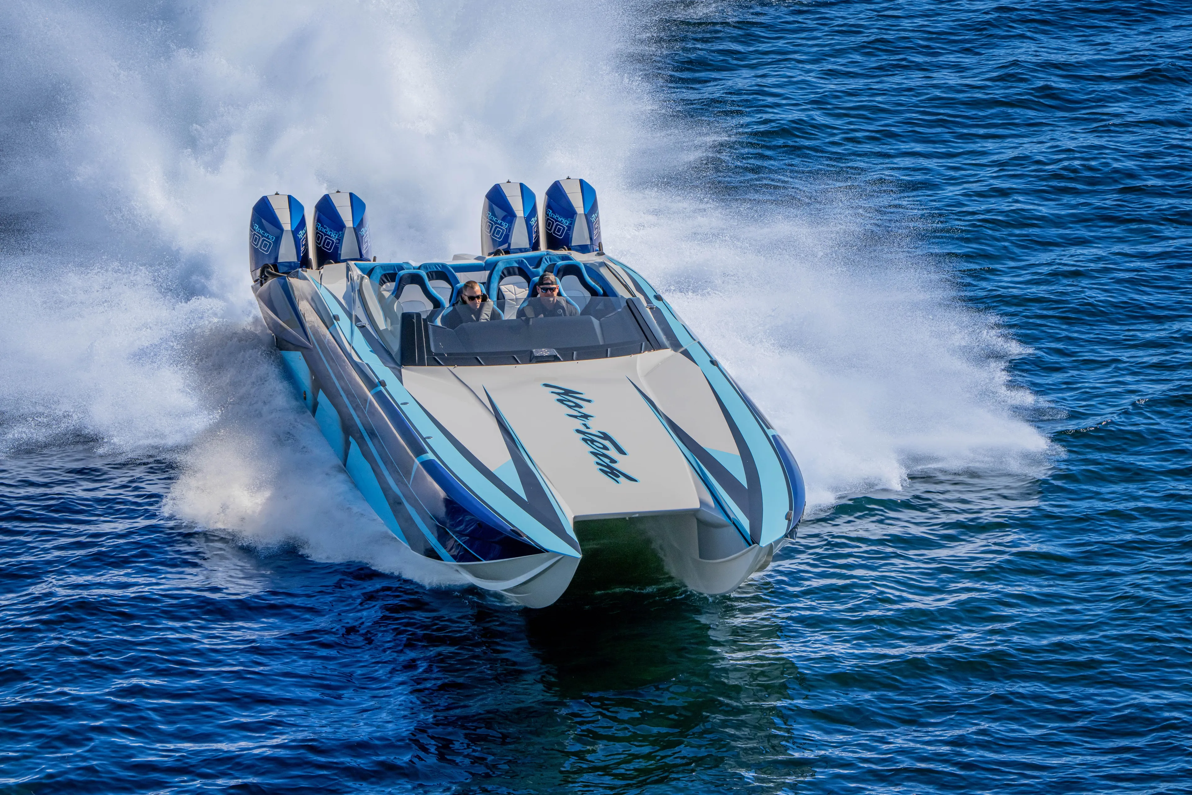  Yacht Photos Pics 2026 Nor-Tech 4000 Super Catamaran speeding on water, showcasing powerful performance and sleek design.