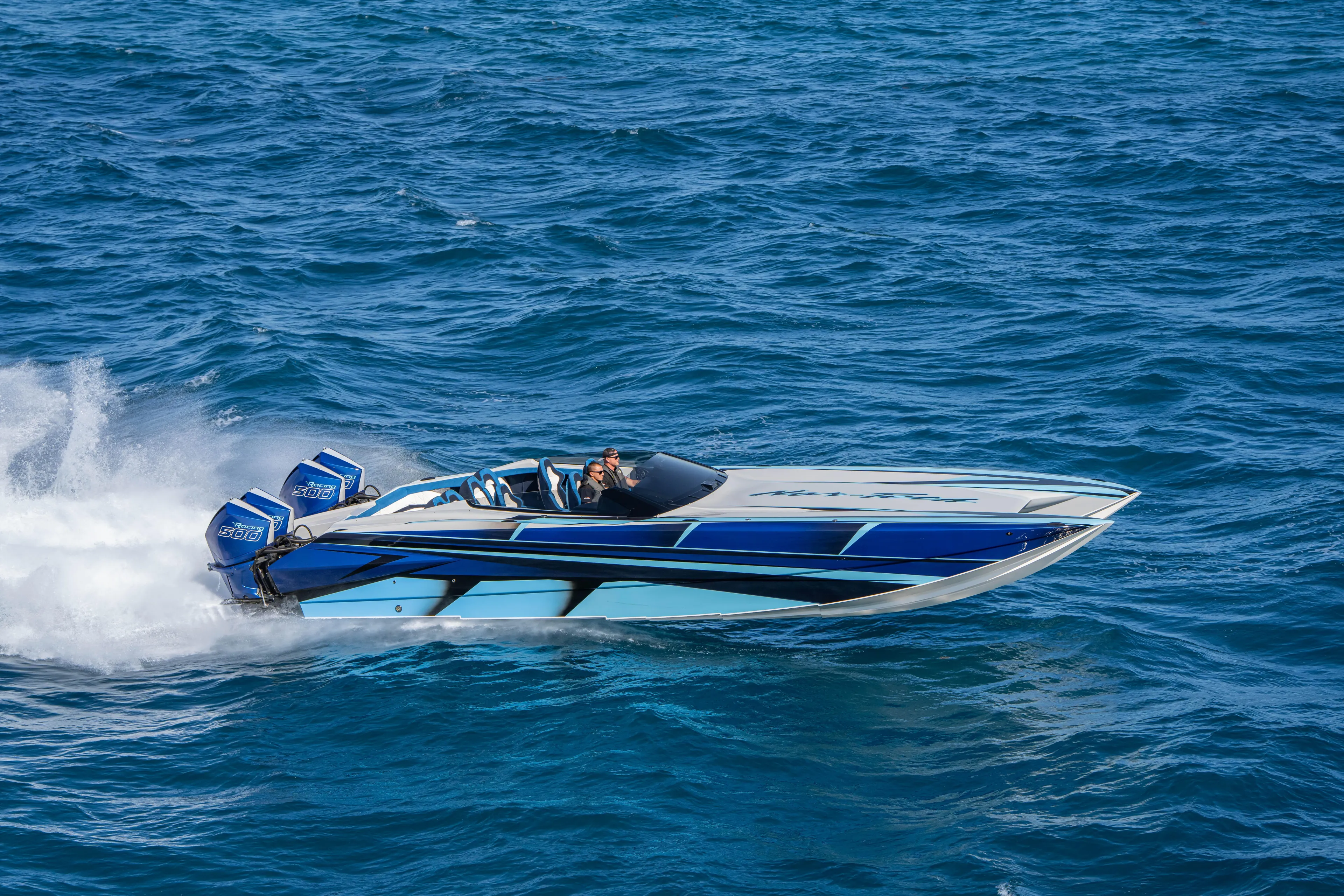  Yacht Photos Pics 2026 Nor-Tech 4000 Super Catamaran speeding on ocean waters.