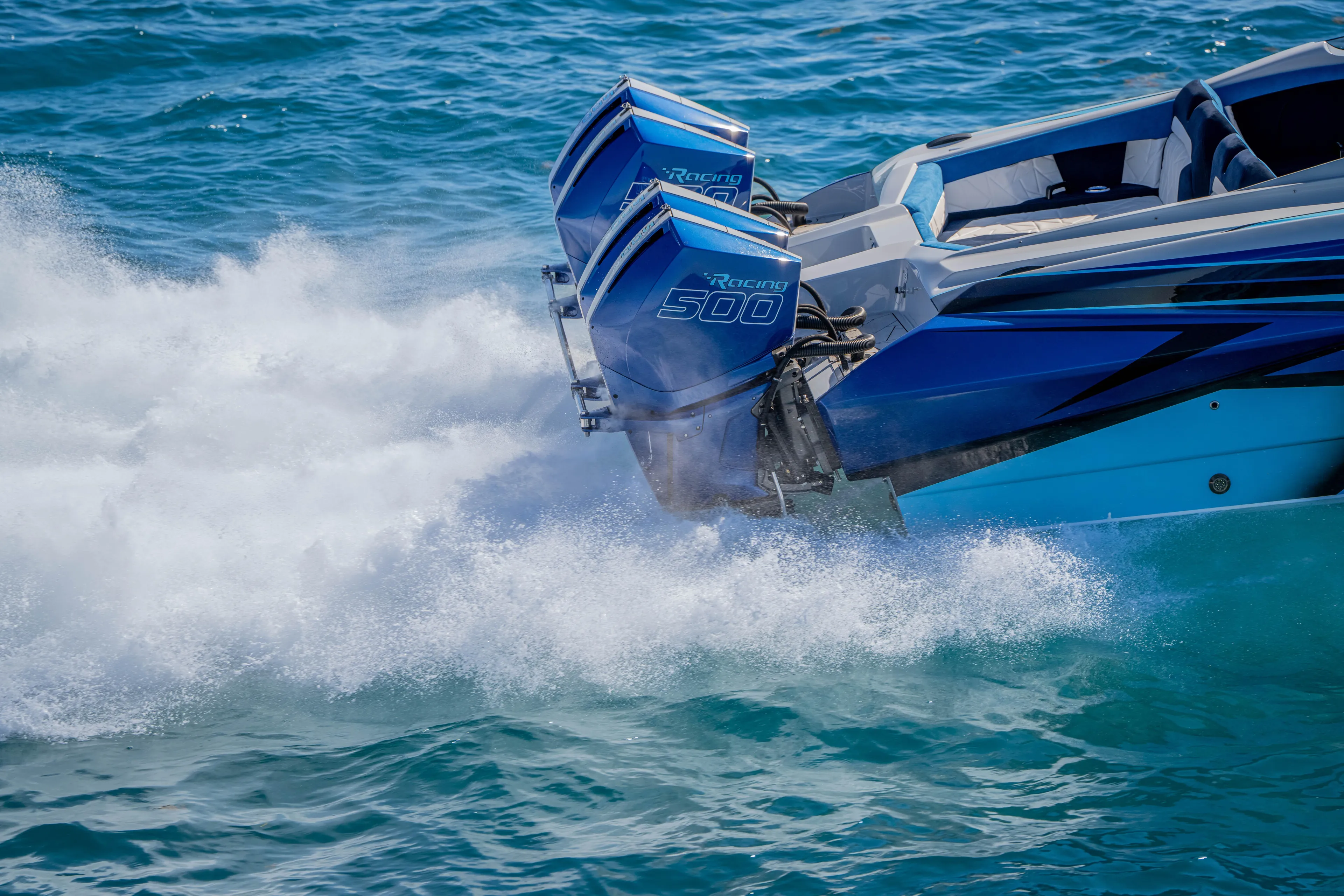  Yacht Photos Pics 2026 Nor-Tech 4000 Super Catamaran speeding on water with powerful engines.