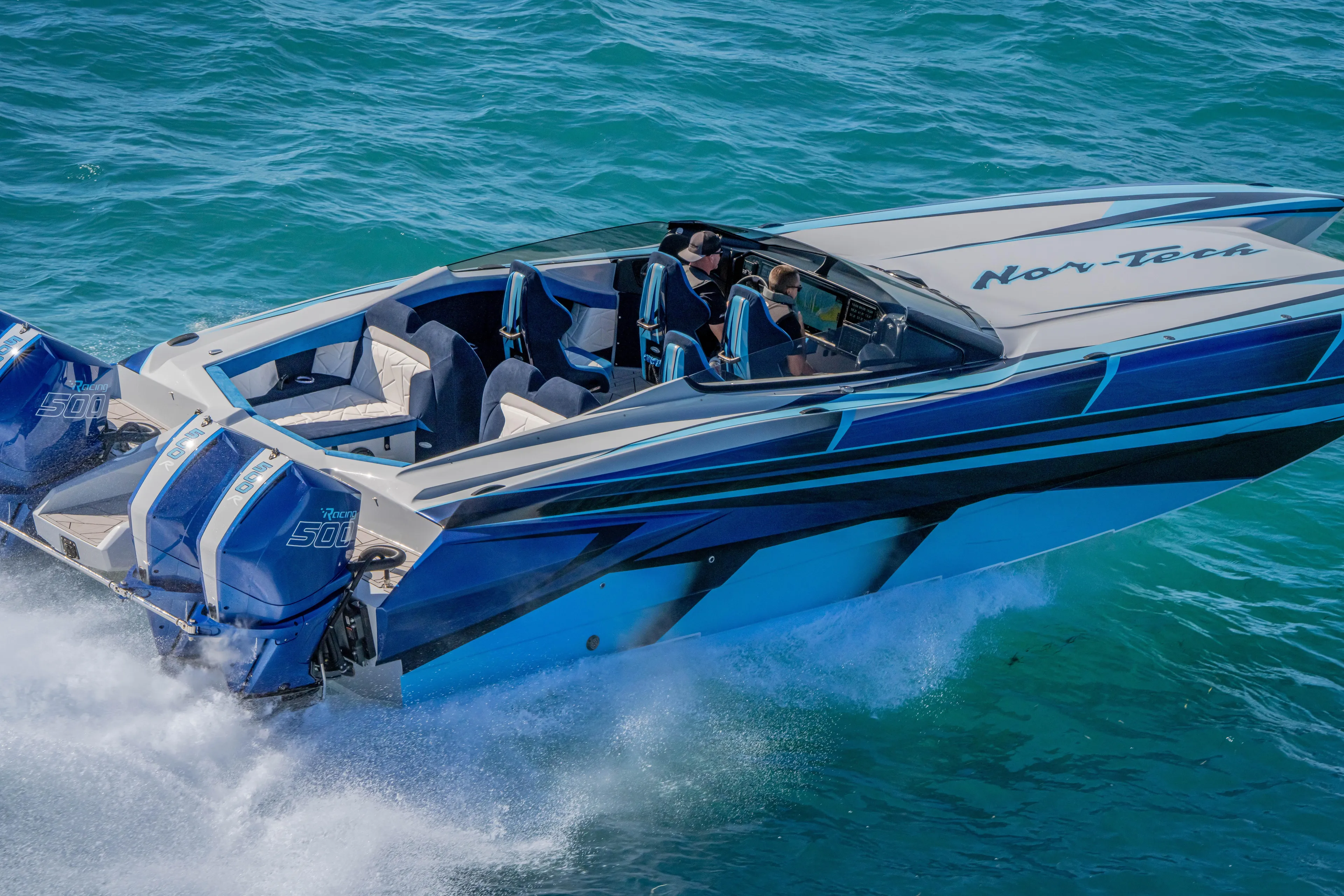  Yacht Photos Pics 2026 Nor-Tech 4000 Super Catamaran speeding on blue ocean waters.