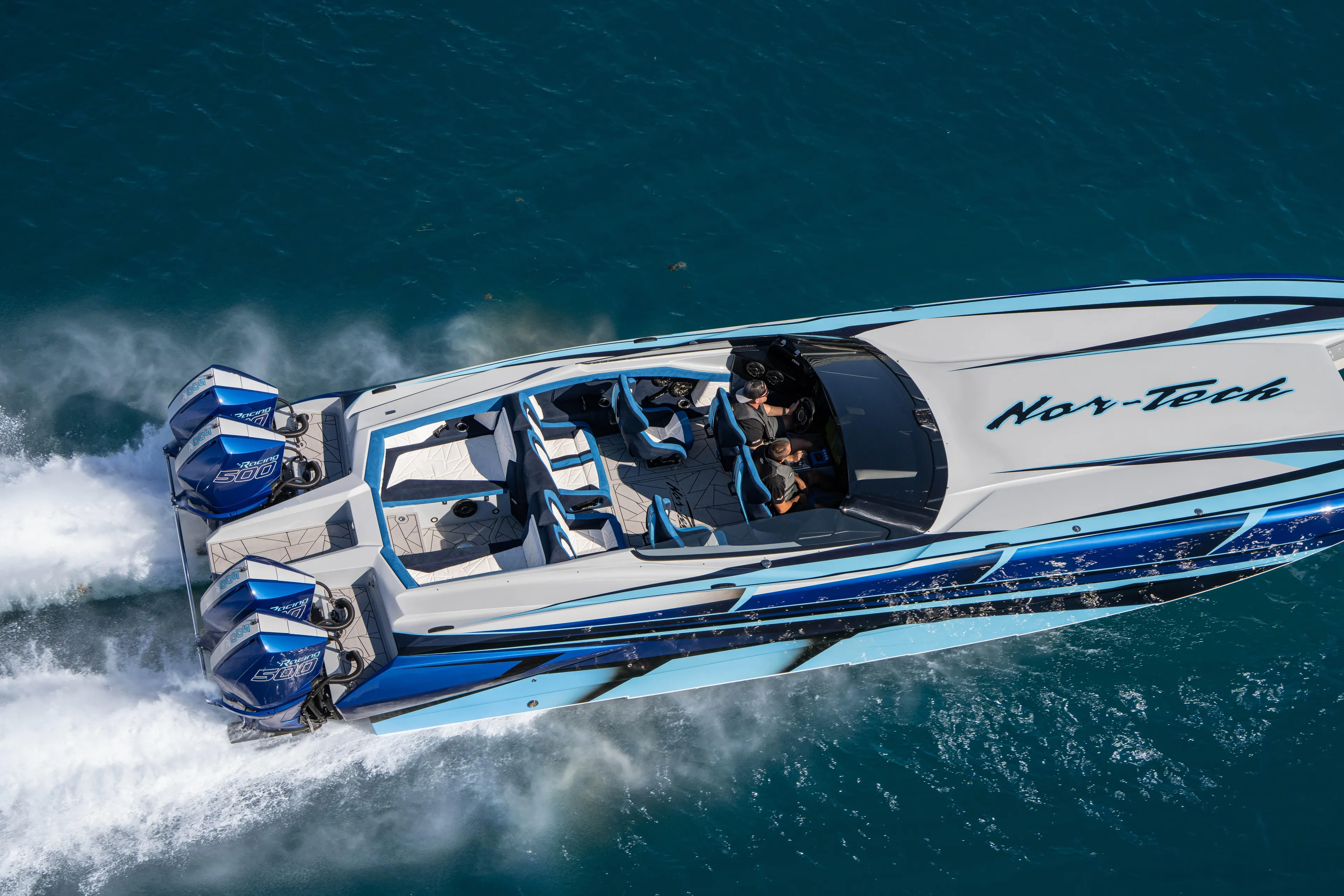  Yacht Photos Pics 2026 Nor-Tech 4000 Super Catamaran speeding on blue ocean waters.