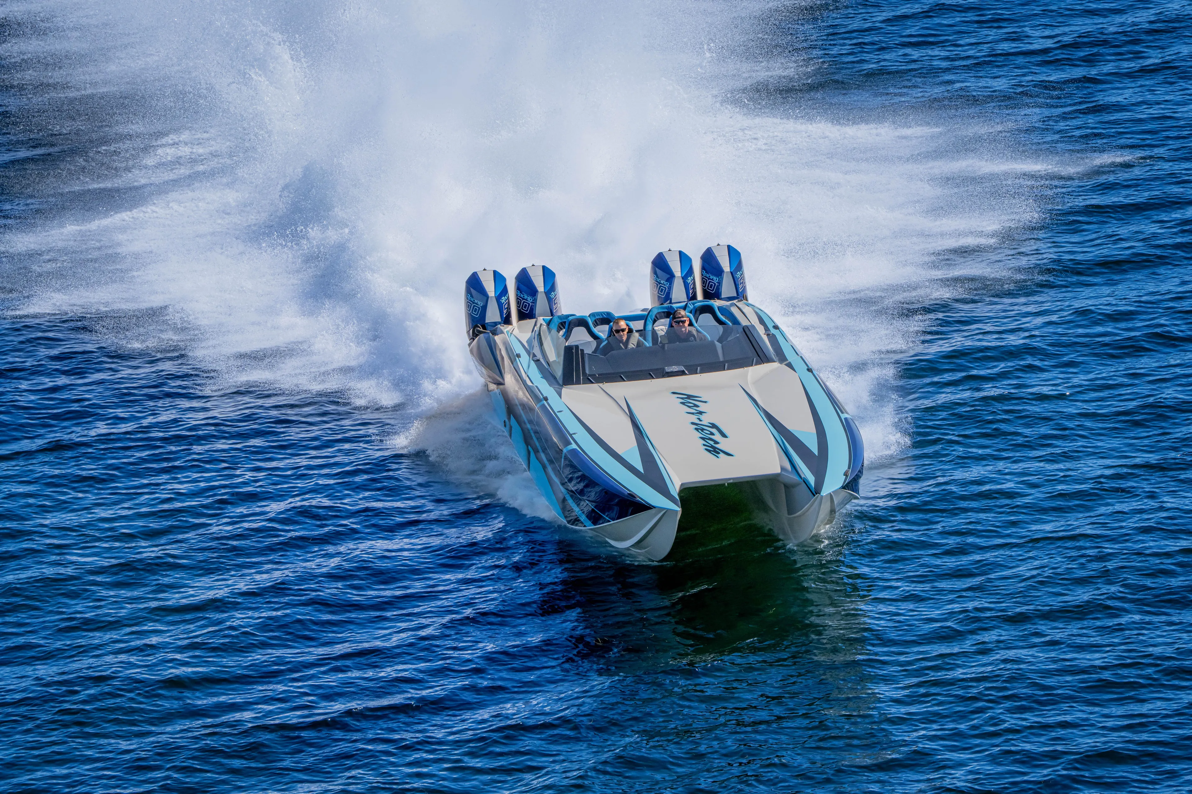  Yacht Photos Pics 2026 Nor-Tech 4000 Super Catamaran speeding on open water, creating a dramatic wake.
