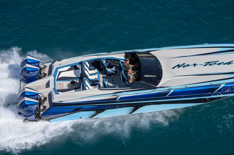  Yacht Photos Pics 2026 Nor-Tech 4000 Super Catamaran speeding on blue ocean waters.