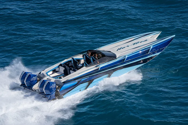  Yacht Photos Pics 2026 Nor-Tech 4000 Super Catamaran speeding on ocean waters.