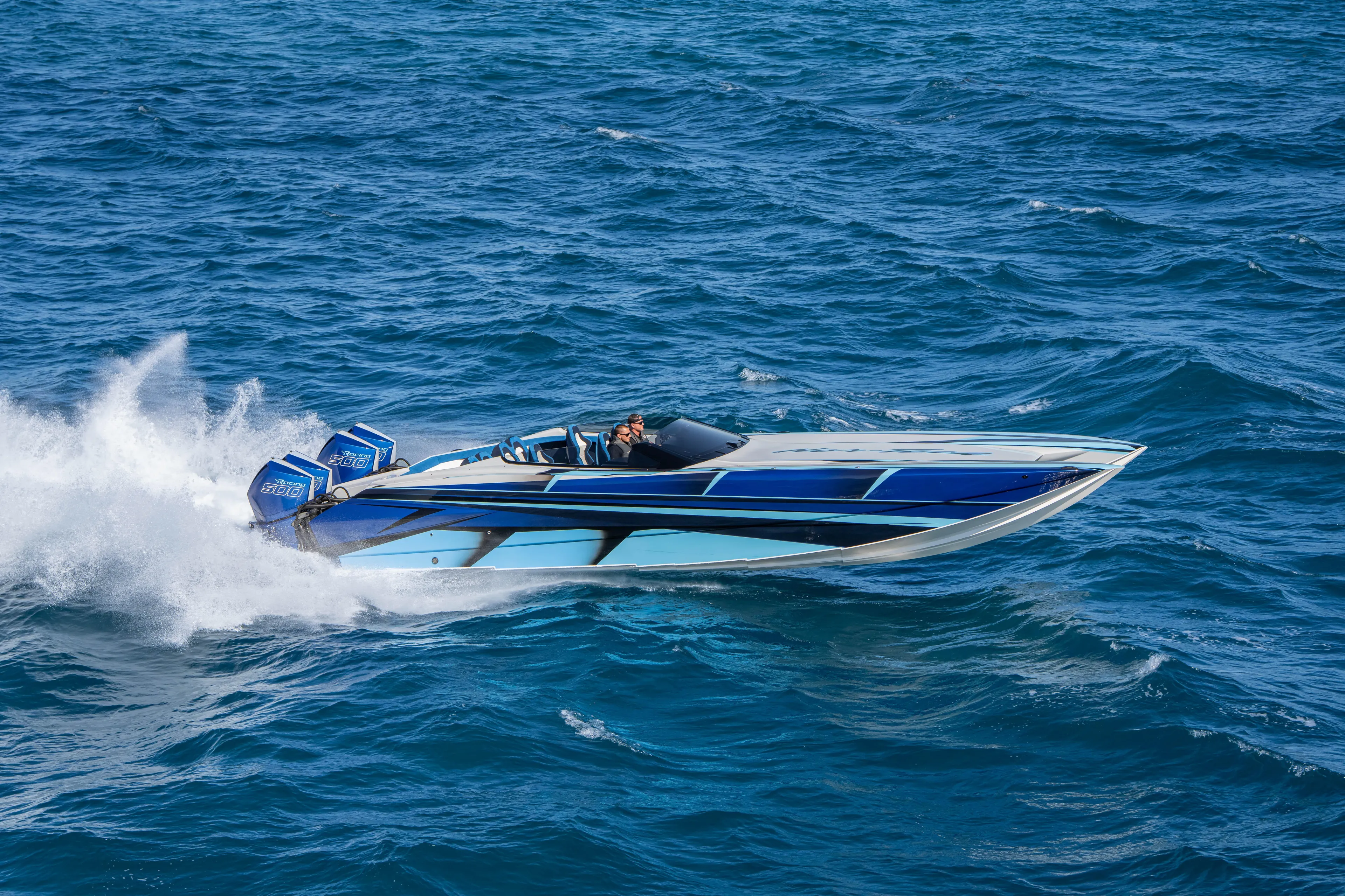  Yacht Photos Pics 2026 Nor-Tech 4000 Super Catamaran speeding on ocean waves.