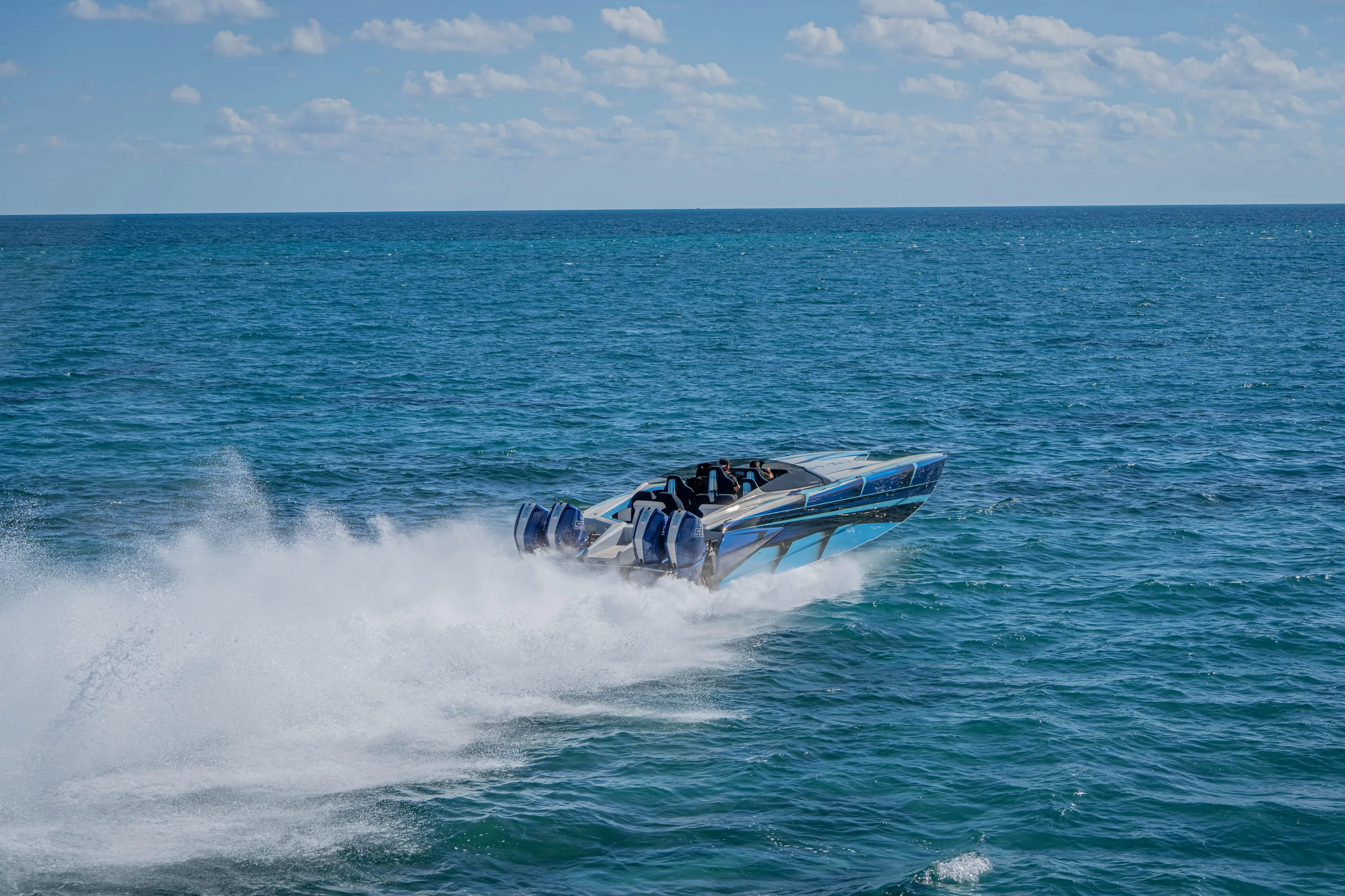  Yacht Photos Pics 2026 Nor-Tech 4000 Super Catamaran speeding on open ocean under clear skies.