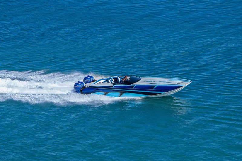  Yacht Photos Pics 2026 Nor-Tech 4000 Super Catamaran speeding on blue ocean waters.