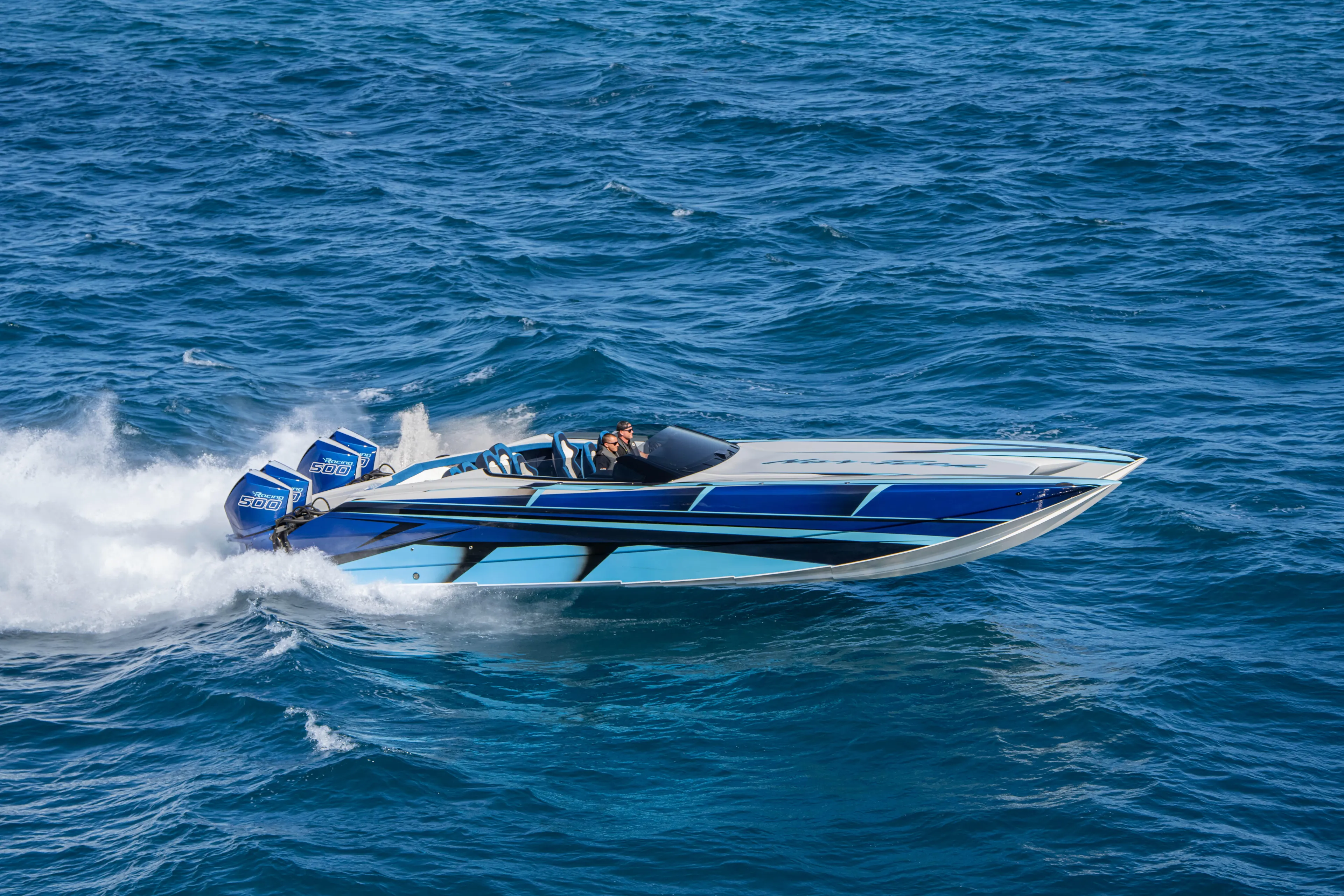  Yacht Photos Pics 2026 Nor-Tech 4000 Super Catamaran speeding on open blue ocean waters.